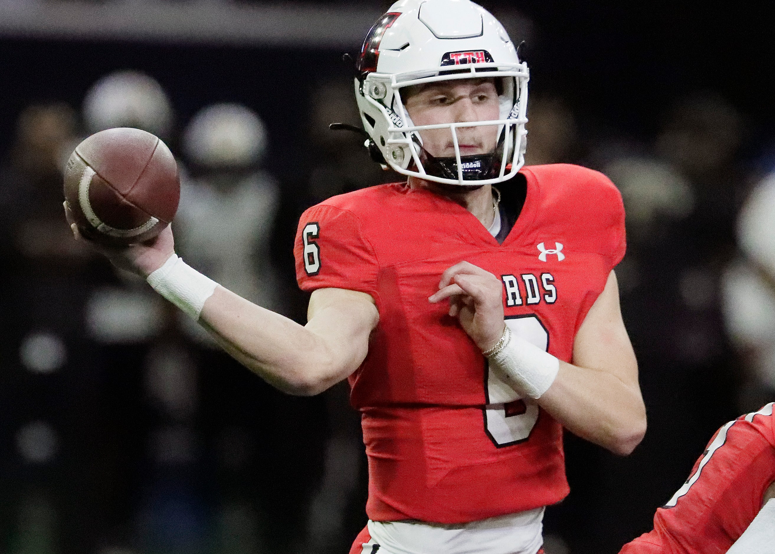 Melissa High School quarterback Trever Ham (6) throws a pass during the first half as...