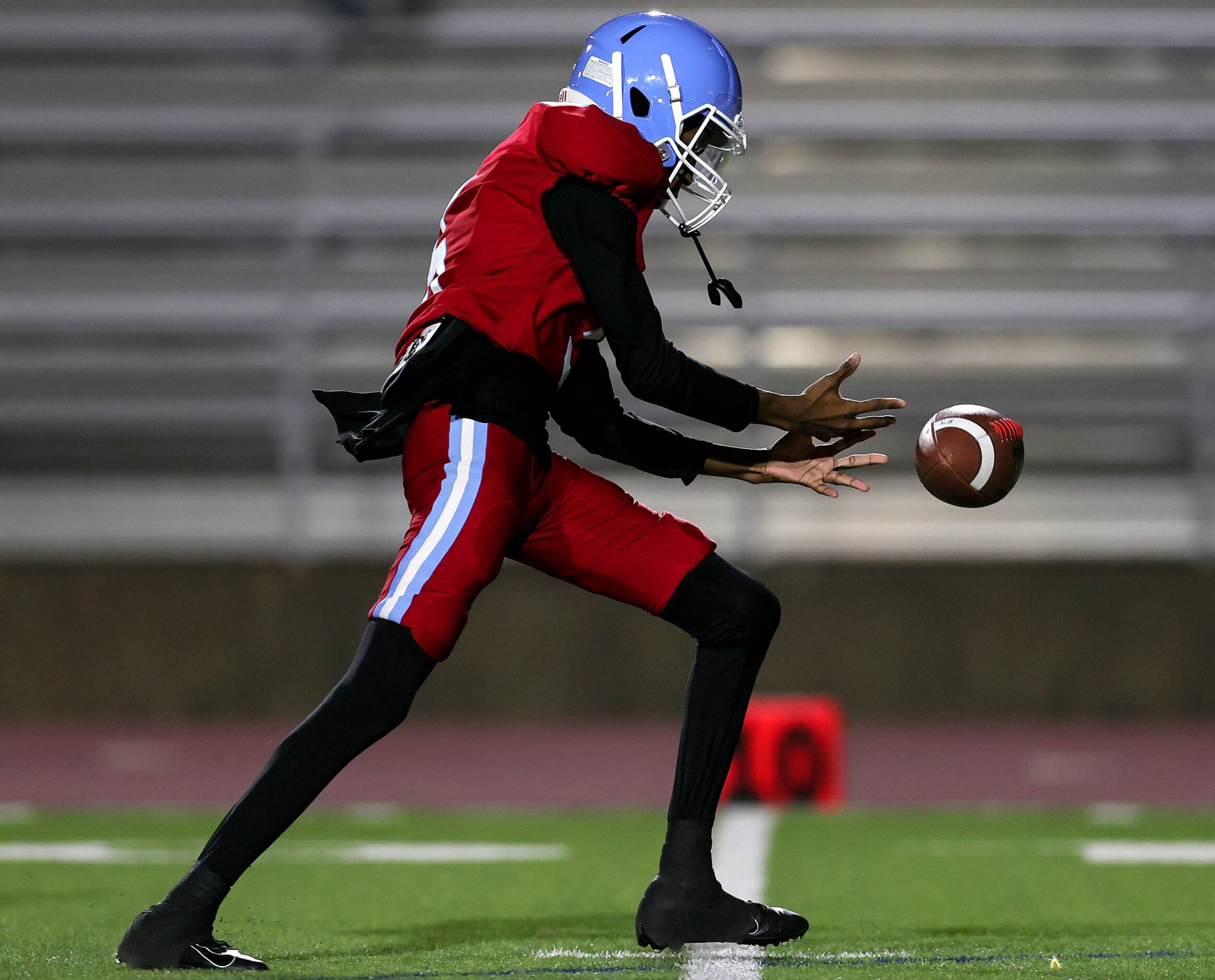 Thomas Jefferson quarterback Desmond Douglas tries to pick up the loose ball against...