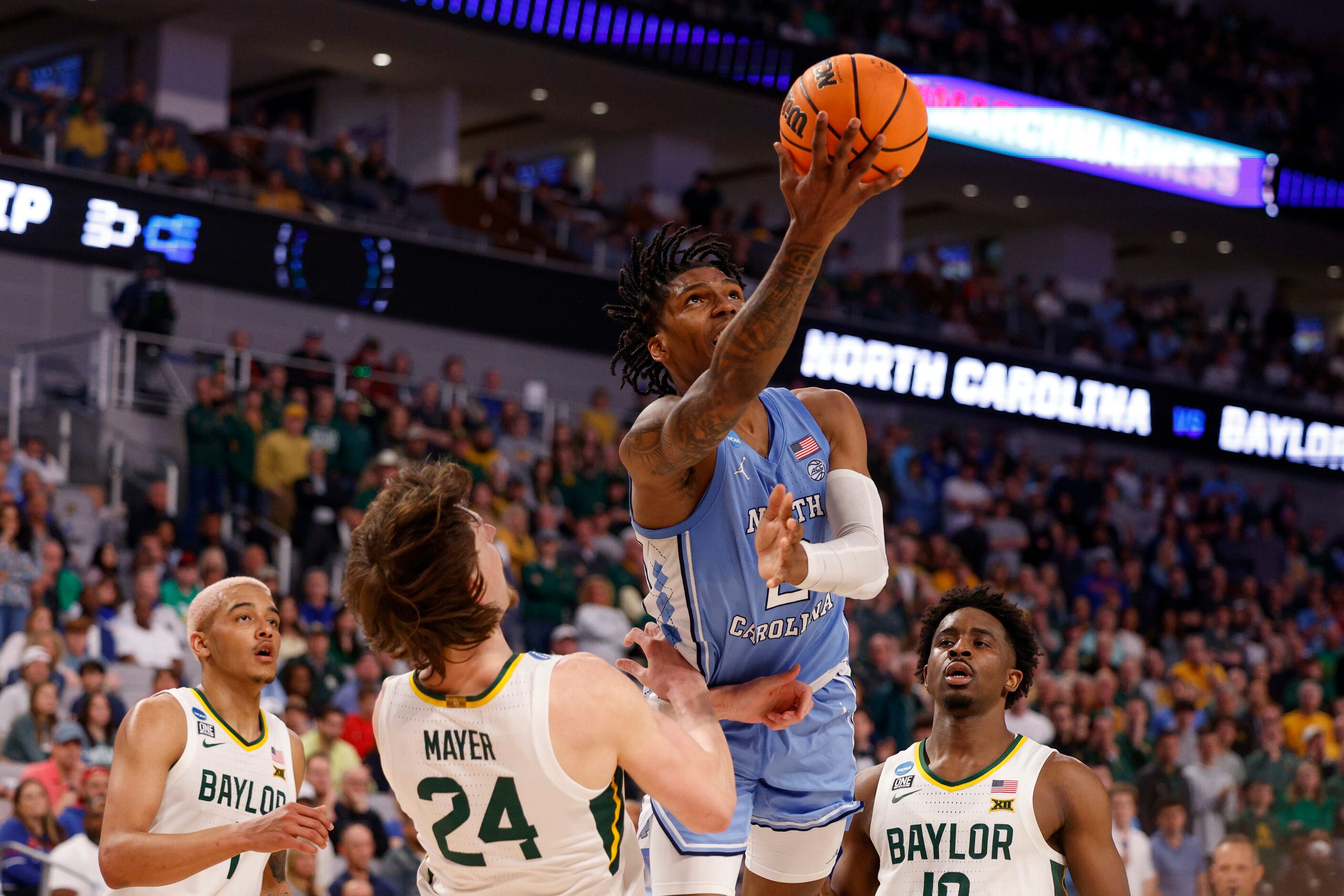 Baylor Bears guard Matthew Mayer (24) takes a charge from North Carolina Tar Heels guard...