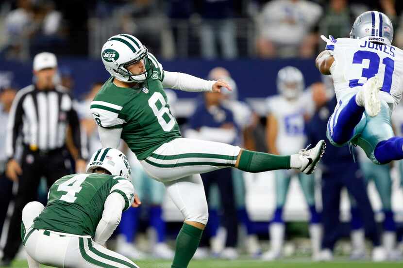 New York Jets kicker Randy Bullock (8) kicks the game winning field goal as Dallas Cowboys...