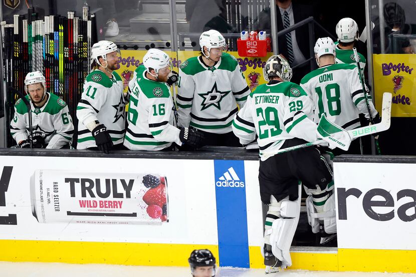 Dallas Stars goaltender Jake Oettinger (29) and his teammates head to the locker room after...