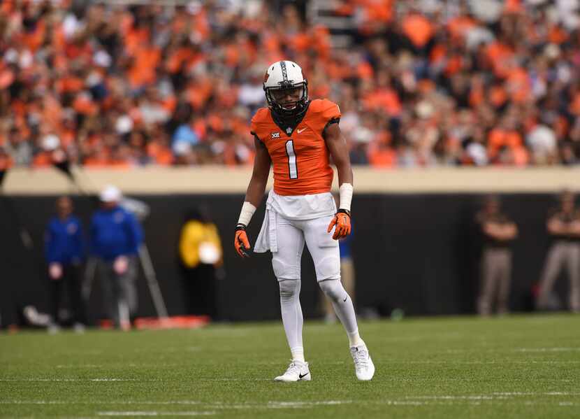 Oklahoma St wide receiver Jalen McCleskey looks over the defense during a NCAA college...