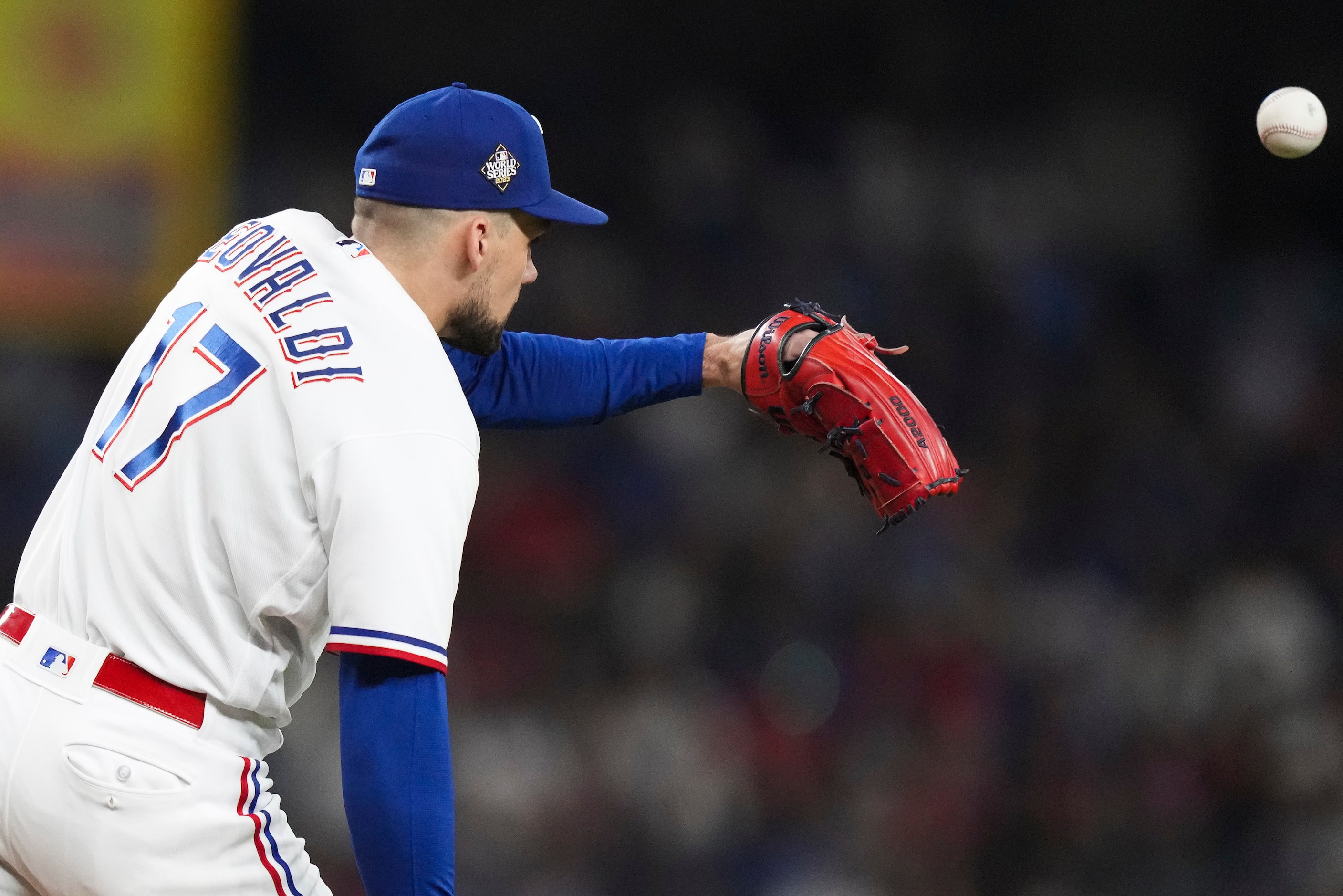 Texas Rangers starting pitcher Nathan Eovaldi (17) can't reach a single by Arizona...