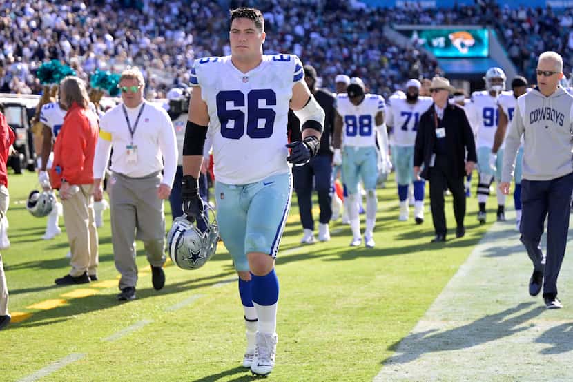 Dallas Cowboys guard Connor McGovern (66) jogs off the field after the first half of an NFL...