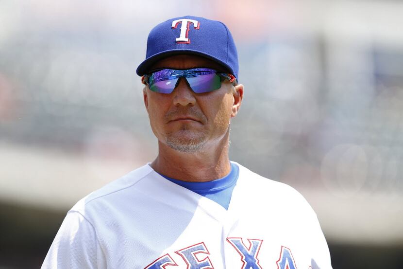 Texas Rangers manager Jeff Banister (28) walks to the dugout after delivering the lineup...