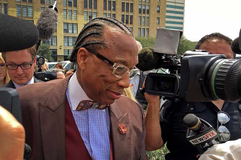 Dallas County Commissioner John Wiley Price walks out of the the Earle Cabell Federal...