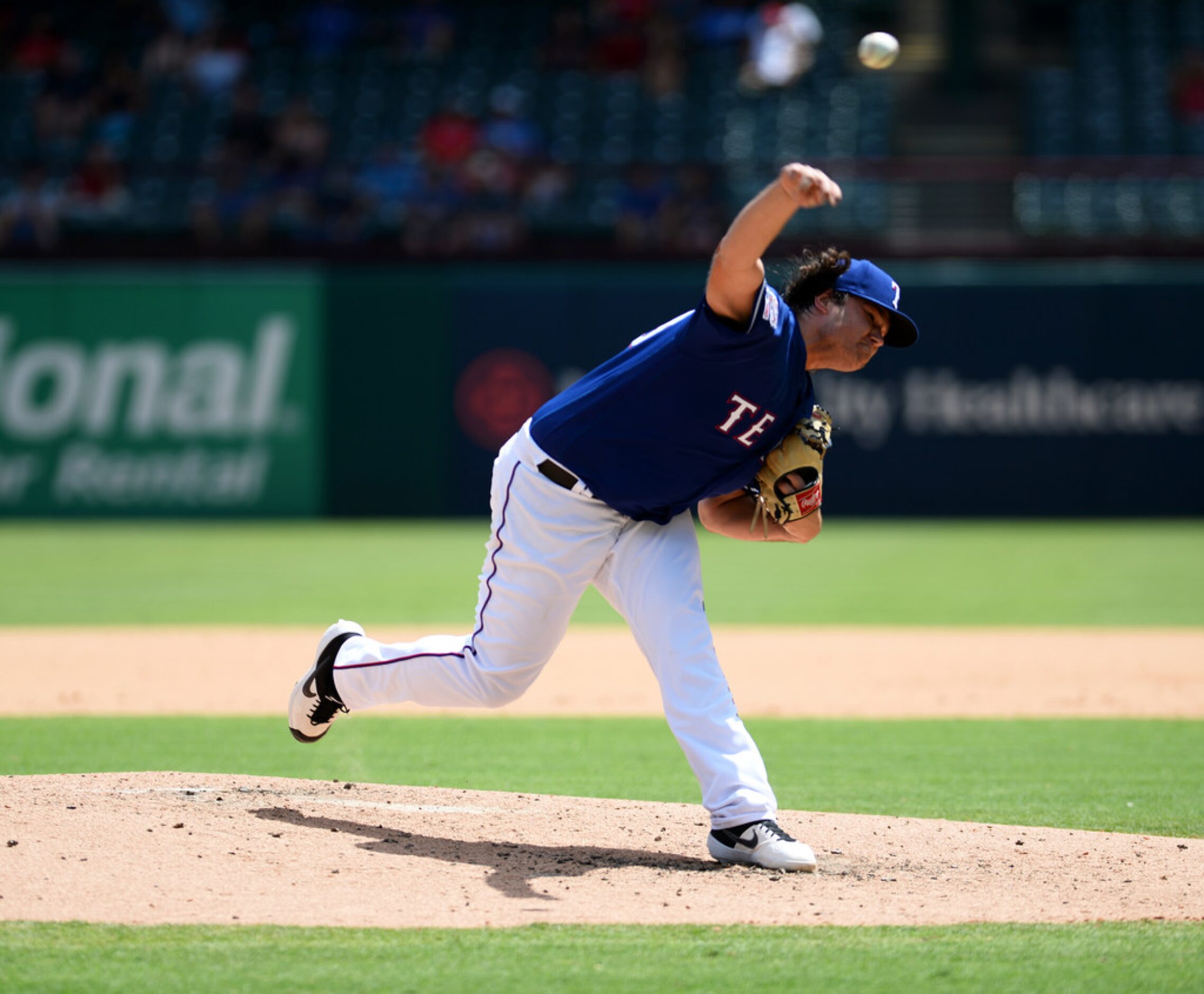 ARLINGTON, TEXAS - AUGUST 20: Ian Gibaut #63 of the Texas Rangers pitches against the Los...