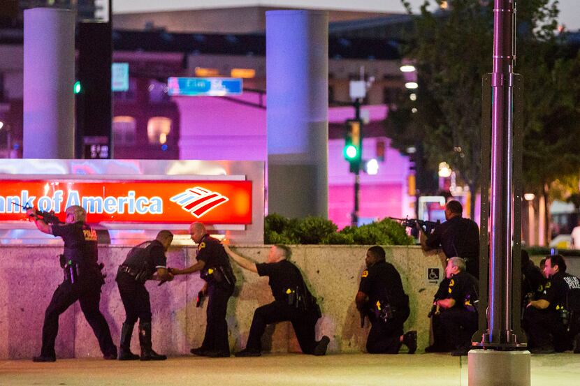 Dallas police respond after shots were fired at the protest in downtown Dallas. 