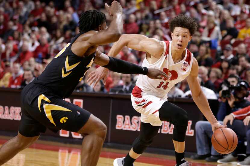 Nebraska's Isaiah Roby (14) drives to the basket against Iowa's Tyler Cook, during the...