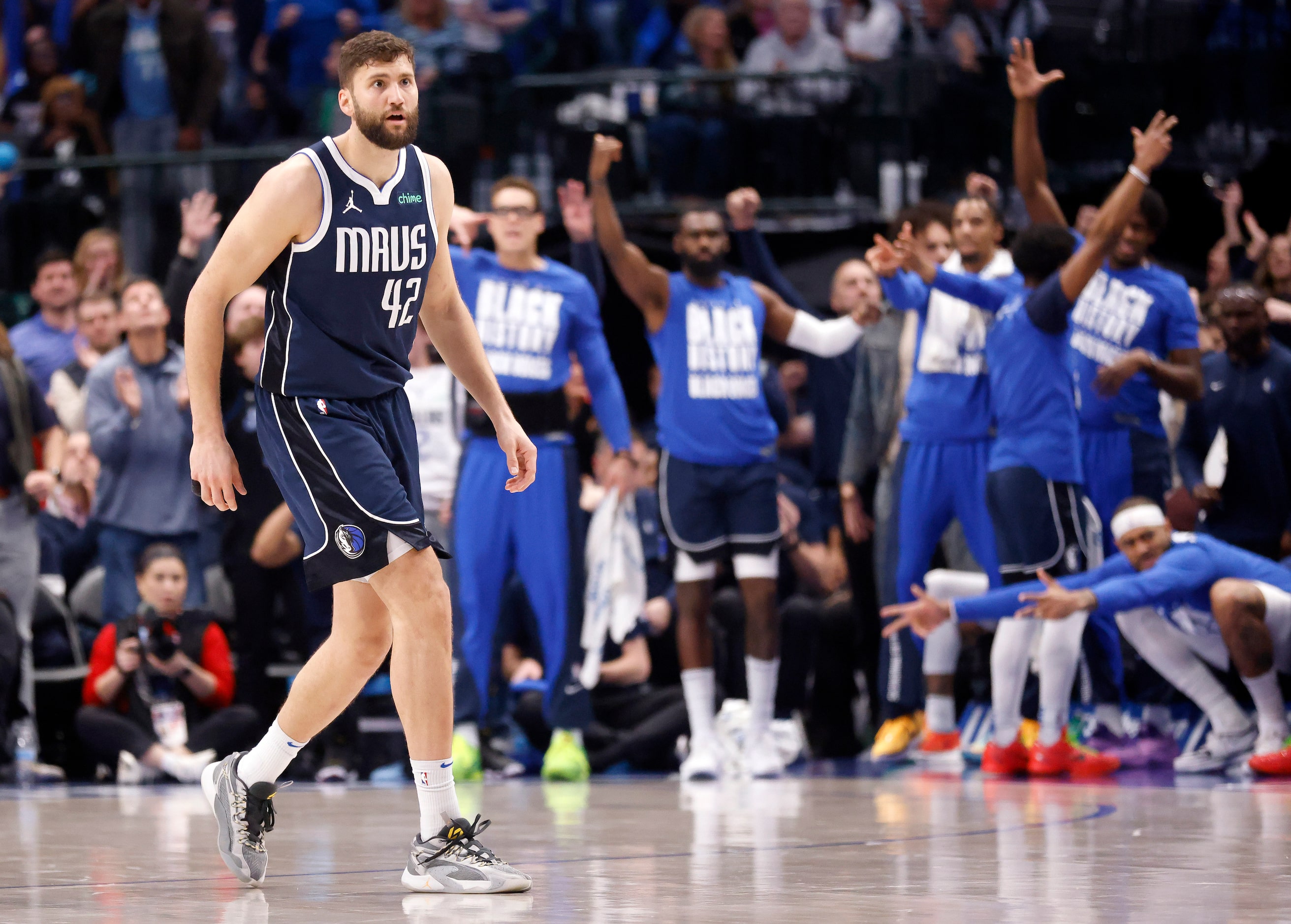 The Dallas Mavericks bench erupts after Dallas Mavericks forward Maxi Kleber (42) hit a...