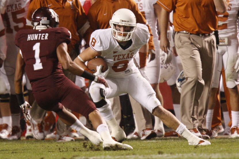 FILE - Texas wide receiver Jaxon Shipley (8) is tackled by Texas A&M defensive back Trent...