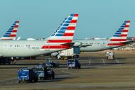 American Airlines planes are seen at the gates of Terminal C at DFW Airport on Monday, Feb....