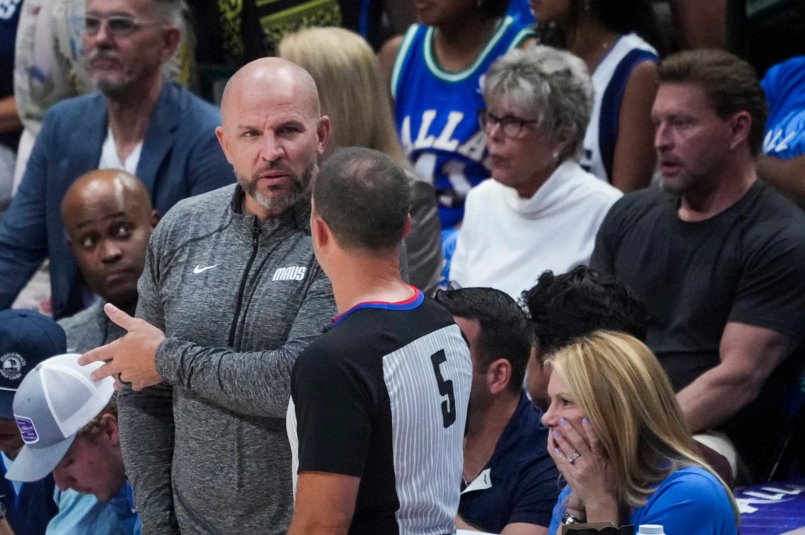 Dallas Mavericks head coach Jason Kidd talks to a referee during the first quarter in Game 4...