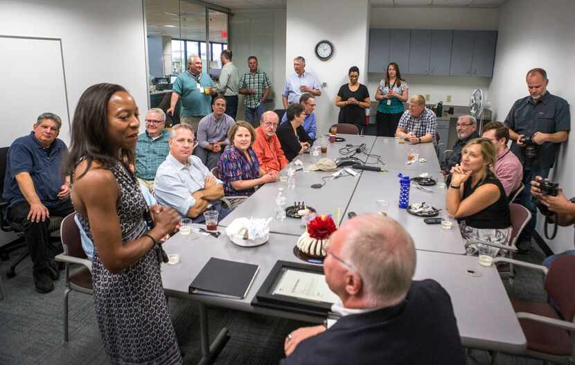 Kim Johnson, news editor, talks to Michael Graczyk, a journalist for The Associated Press,...