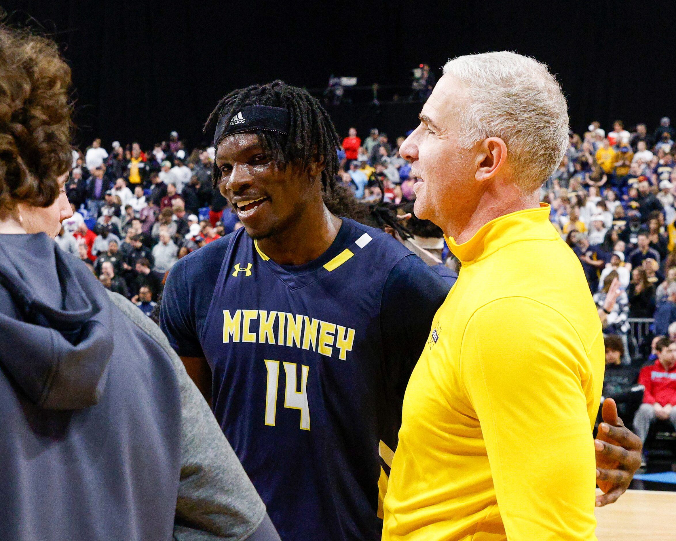 McKinney guard Alex Anamekwe (14) embraces McKinney head coach Wes Watson after winning a...