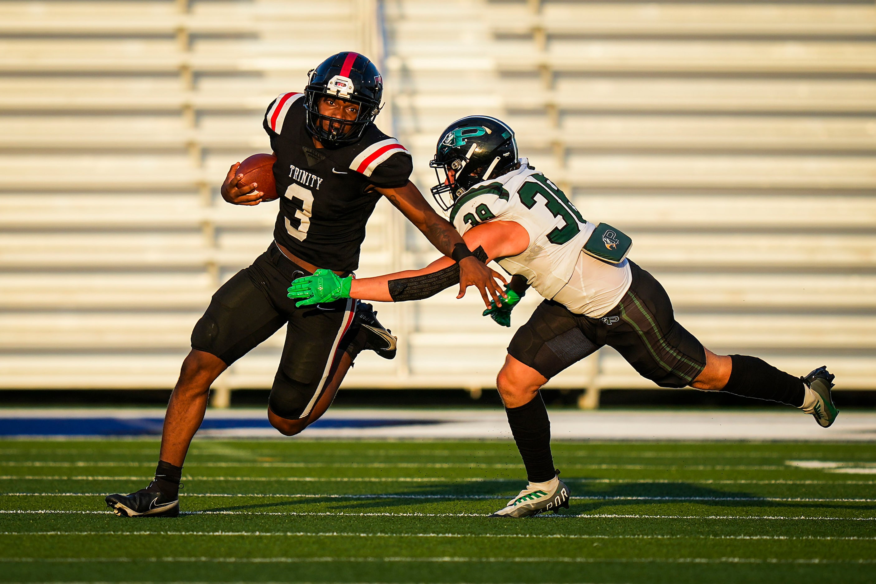 Euless Trinity running back Gary Maddox (3) tries to get around Prosper’s Jonah McClendon...