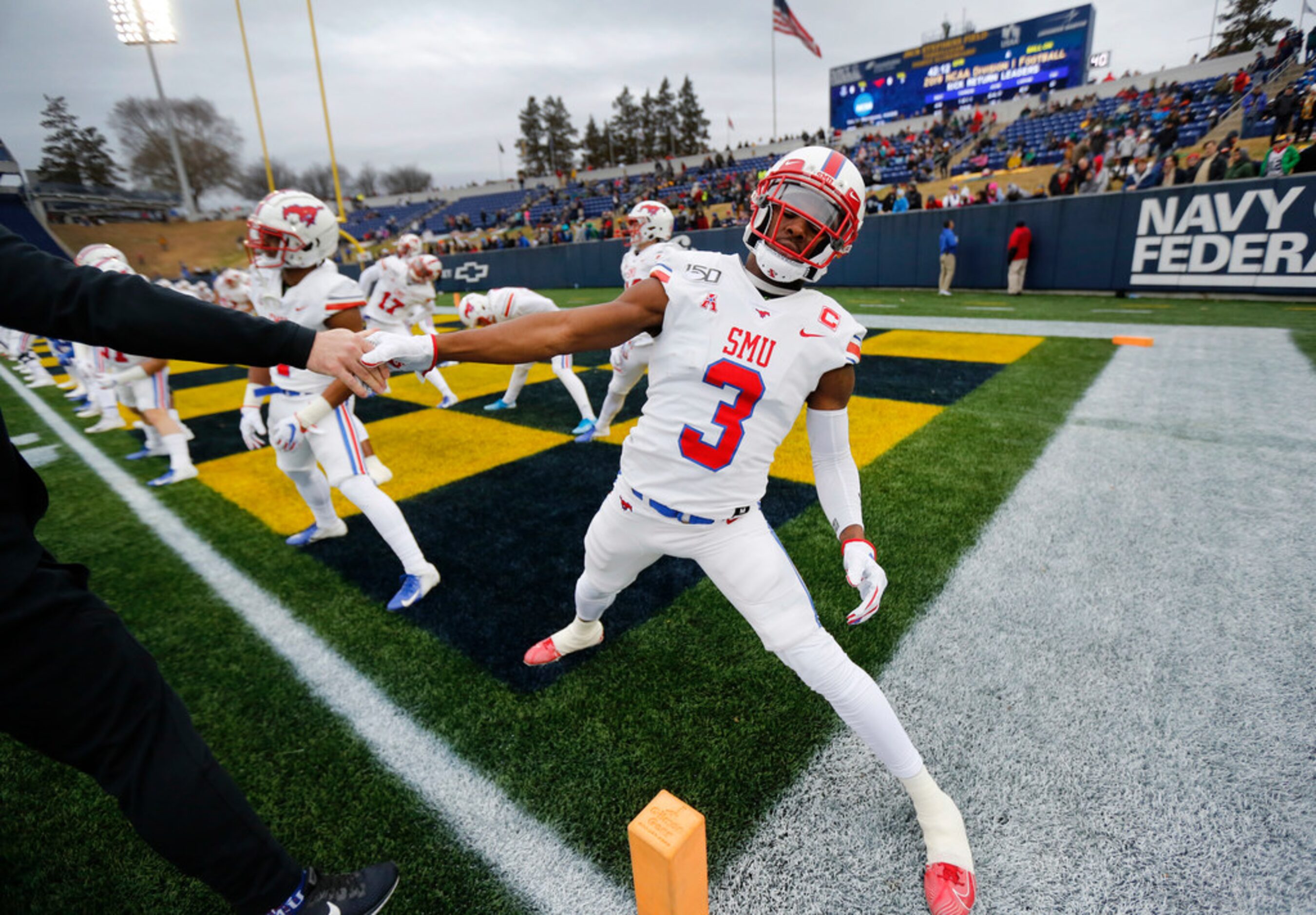 Southern Methodist Mustangs wide receiver James Proche (3) stretches with teammates during...