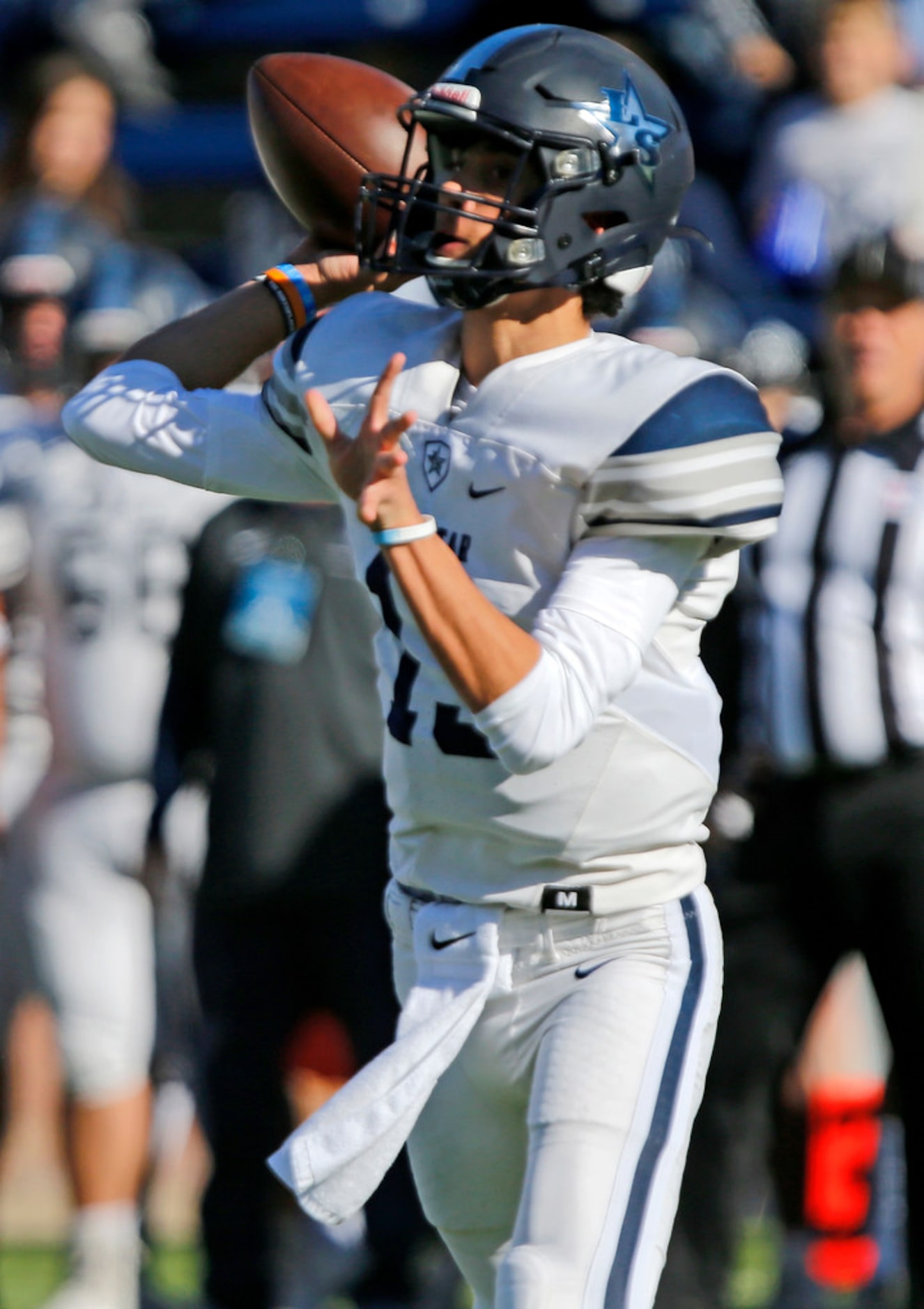 Lone Star High School quarterback Garret Rangel (13) throws a pass during the first half as...