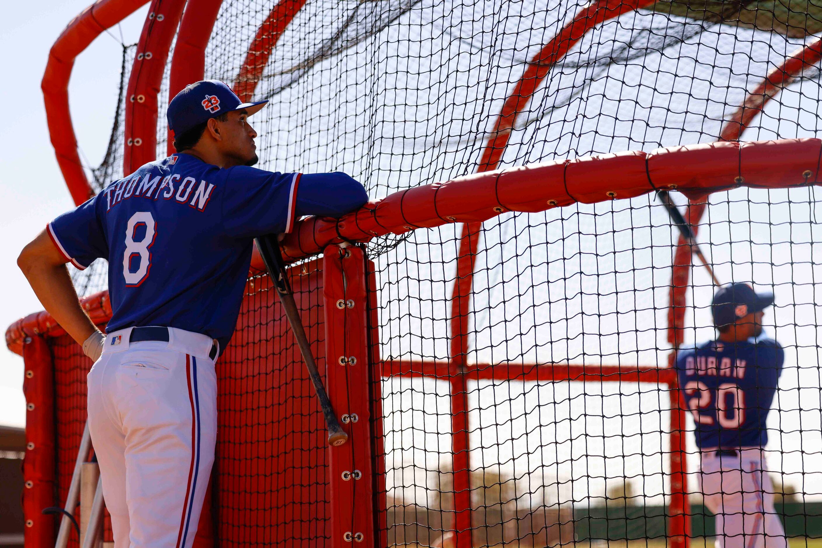 Texas Rangers outfielder Bubba Thompson, left, waits for his turn for batting practice...