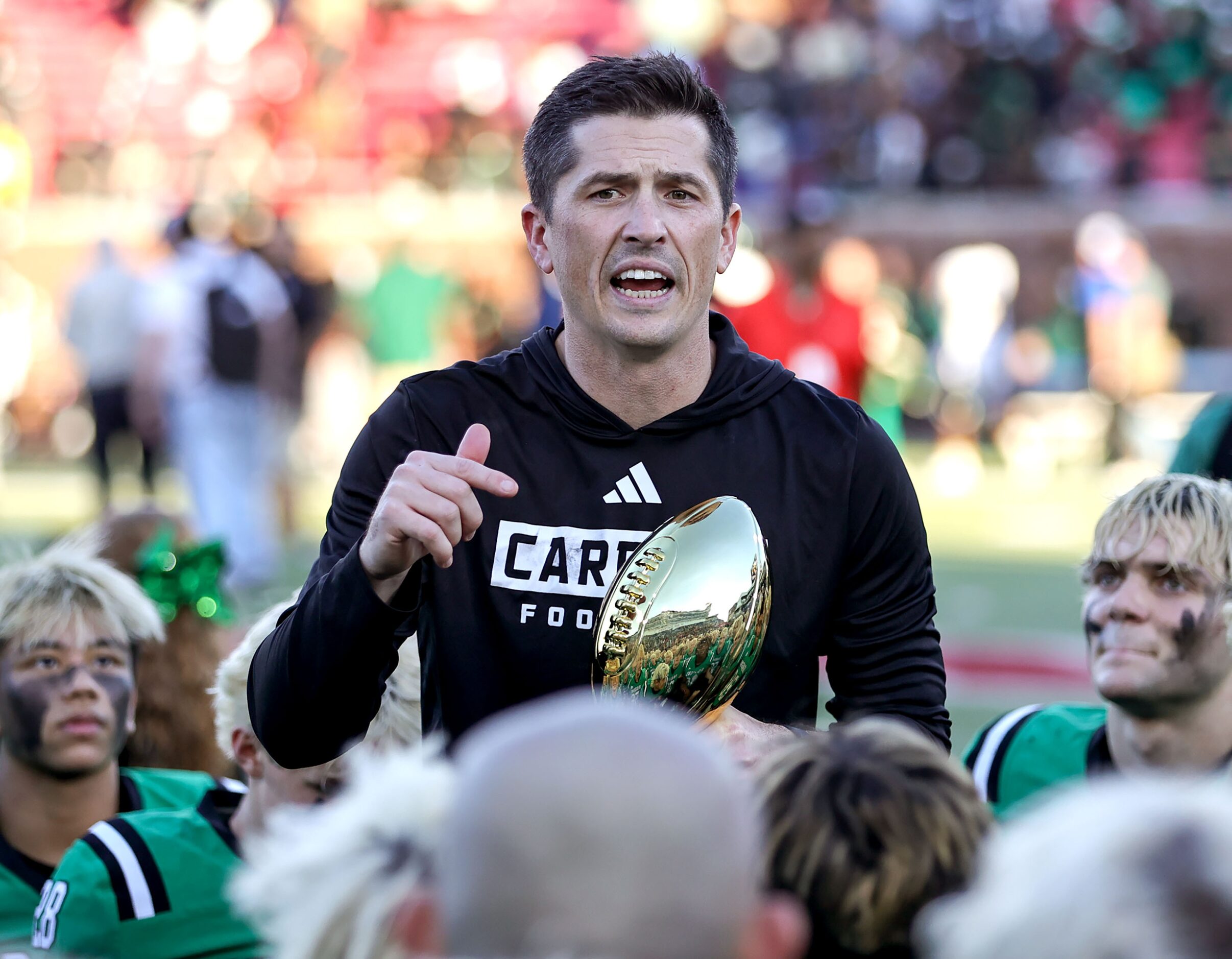 Southlake Carroll head coach Riley Dodge talks to his team after defeating Longview, 20-17...