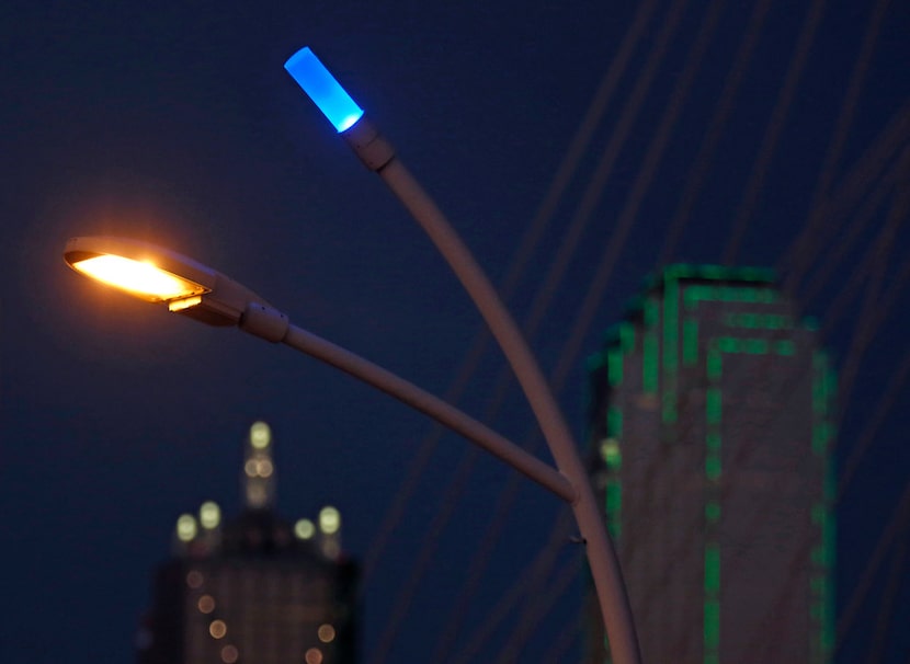 Blue LEDs sit atop the streetlights around the Trinity River at the Ronald Kirk Pedestrian...