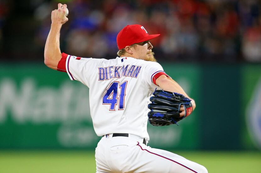 ARLINGTON, TX - SEPTEMBER 02: Jake Diekman #41 of the Texas Rangers throws in the eight...