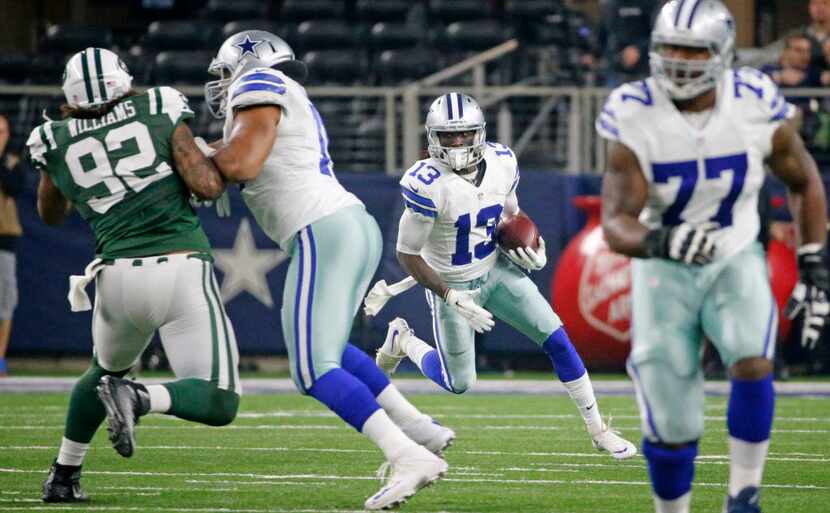 Dallas Cowboys wide receiver Lucky Whitehead (13) gets a convoy of blockers as he motors for...