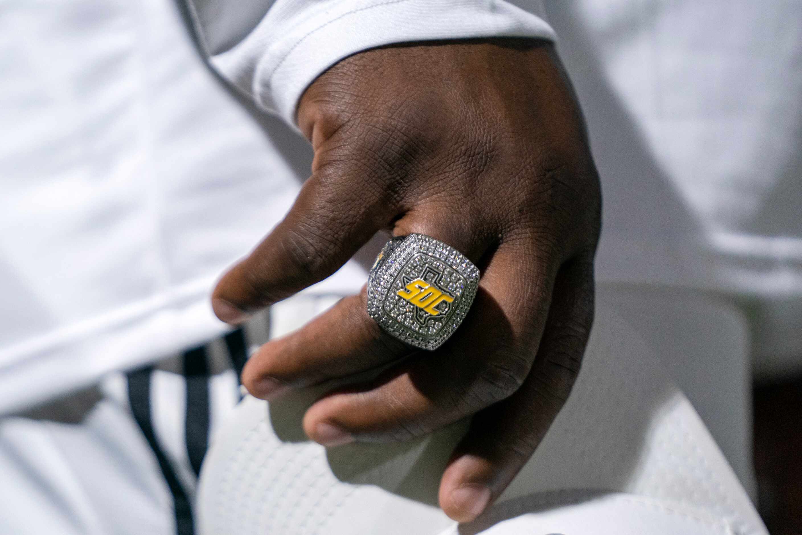 A state championship ring is seen on the finger of South Oak Cliff head coach Jason Todd...
