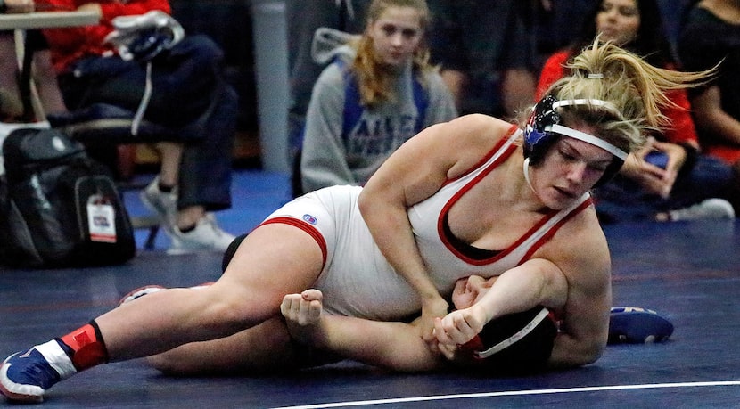 Allen High School wrestler Alex Liles (top) defeated Coppel High School wrestler Allie...