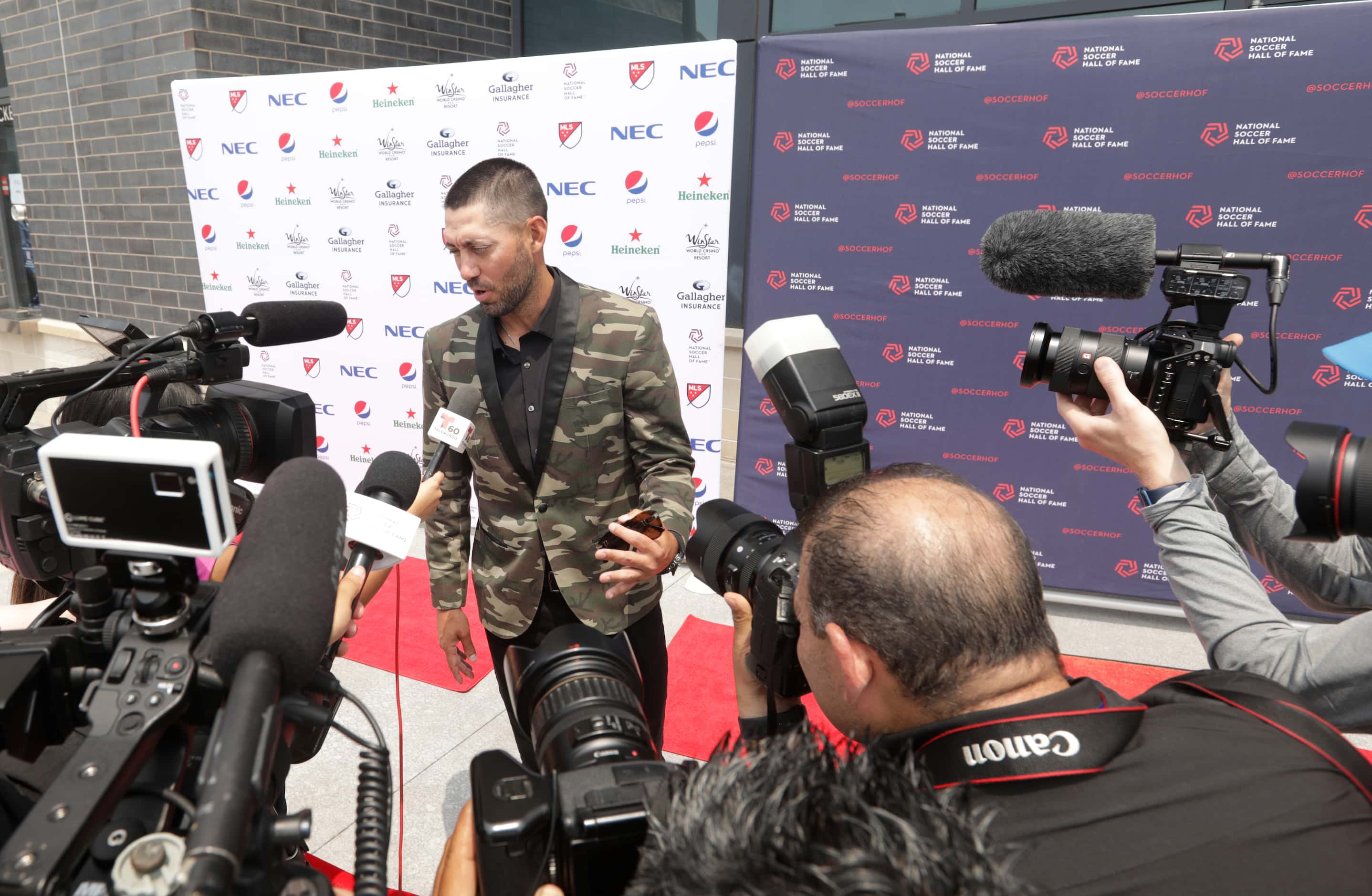 Clint Dempsey does an interview on the red carpet during the National Soccer Hall of Fame...