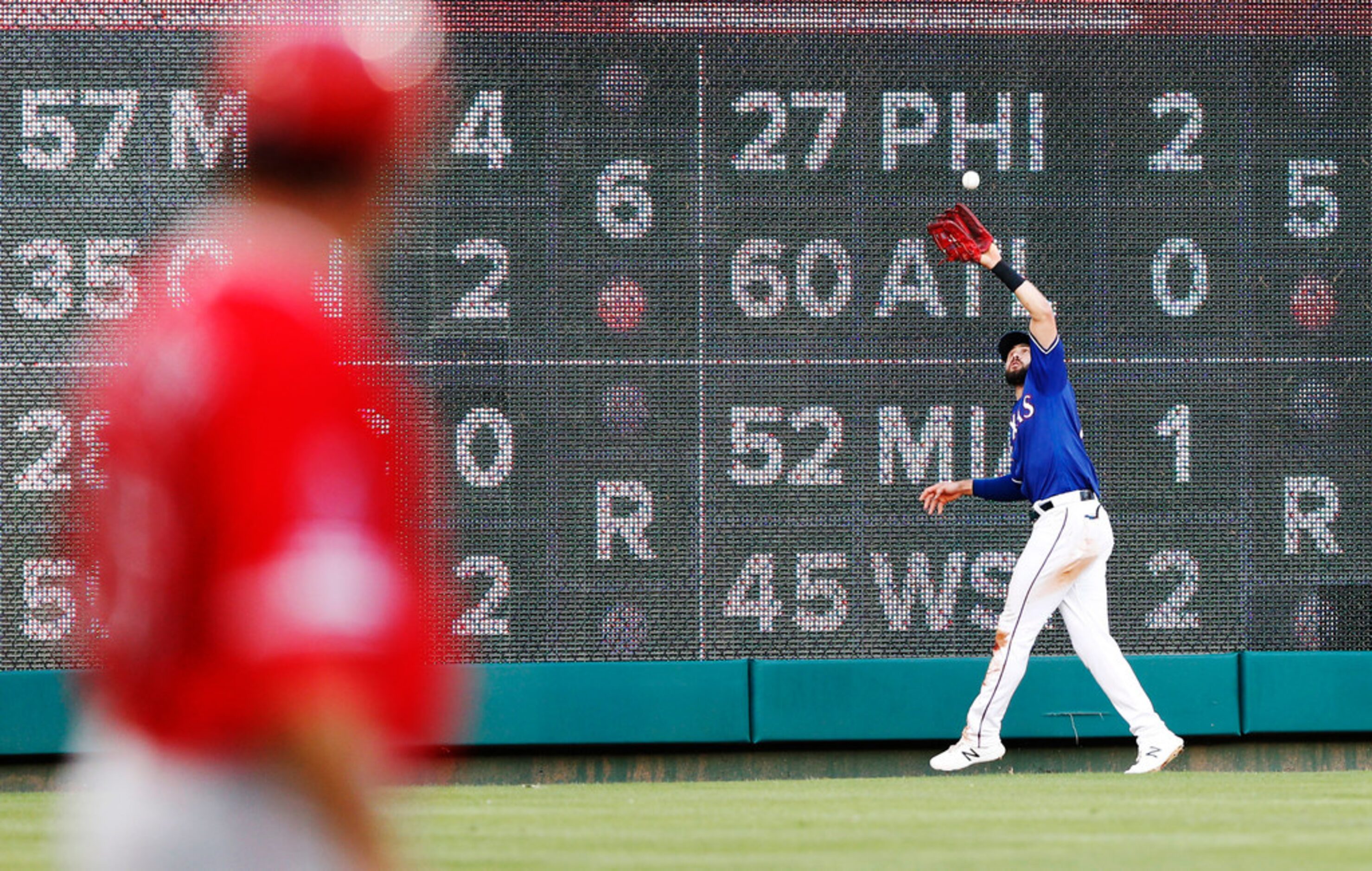 Texas Rangers left fielder Joey Gallo (13) catches a fly ball from Los Angeles Angels...