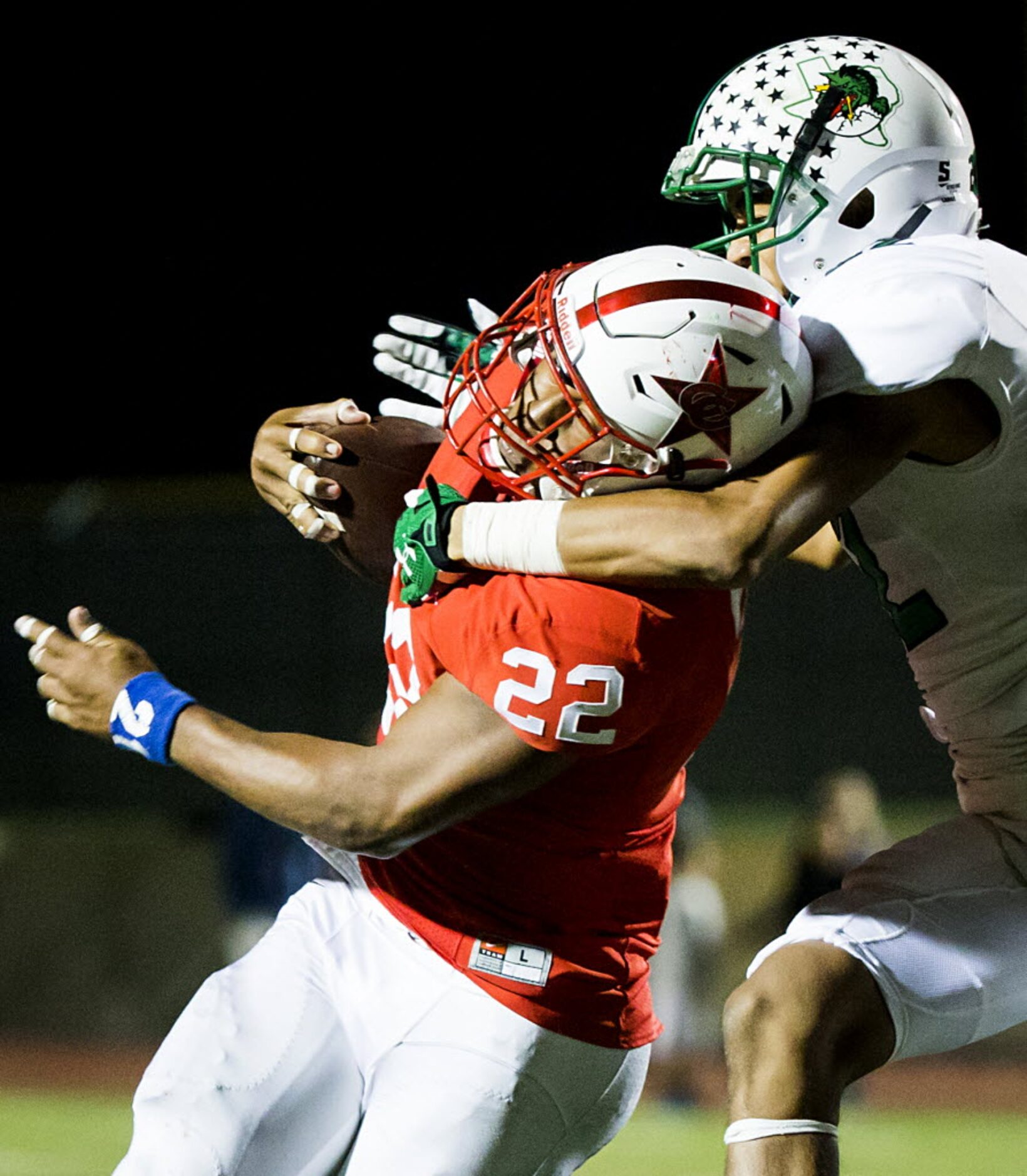 Coppell running back Brandon Rice (22) is wrapped up by Southlake Carroll defensive back...