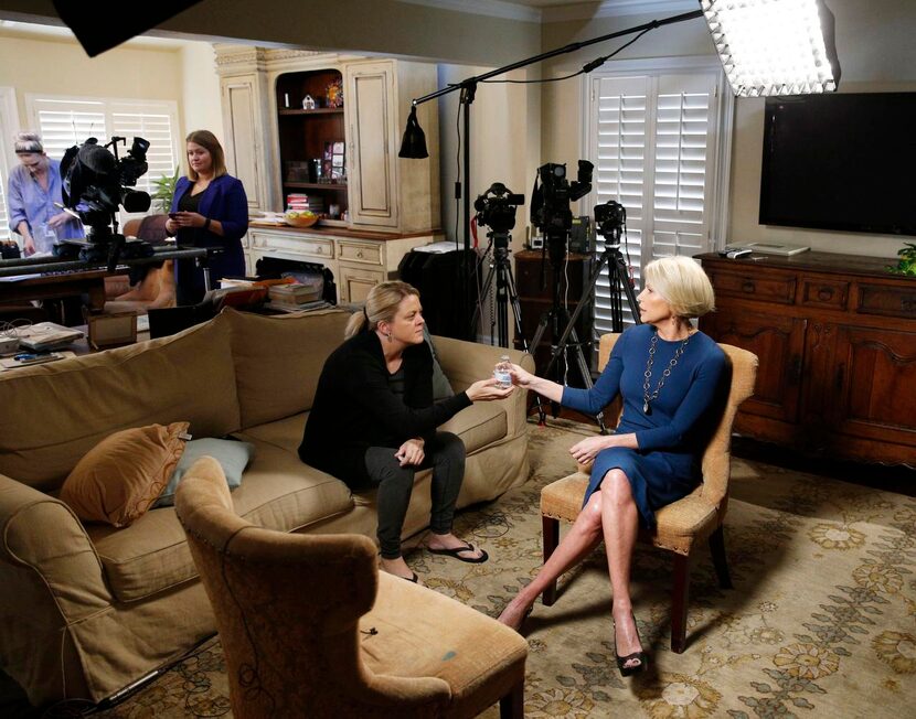 
District Attorney Susan Hawk (right) takes a water bottle from her political adviser Mari...