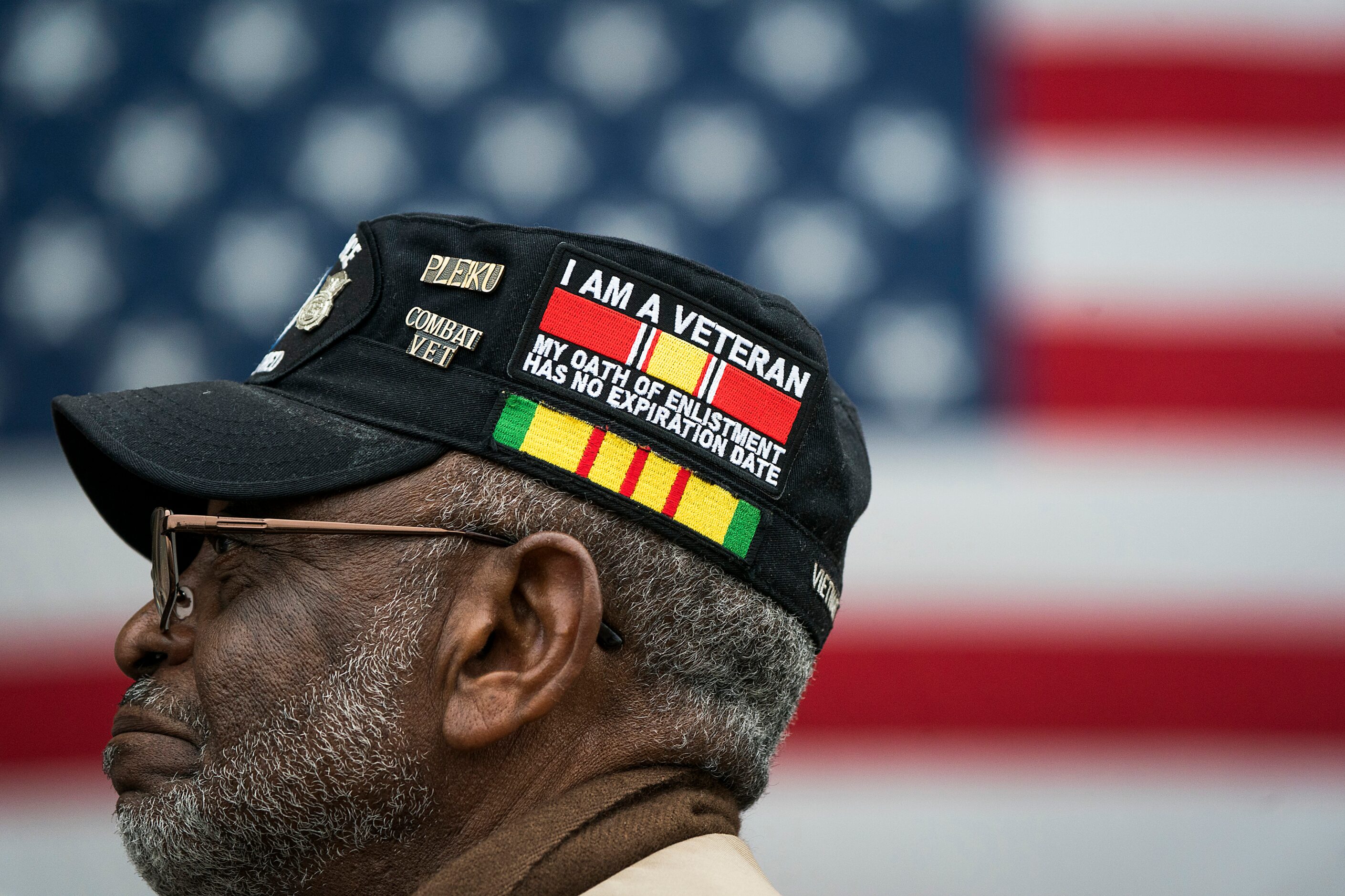 Retired Air Force Master Sgt. Bennie Martin, or Mesquite, listens to a speaker during an...