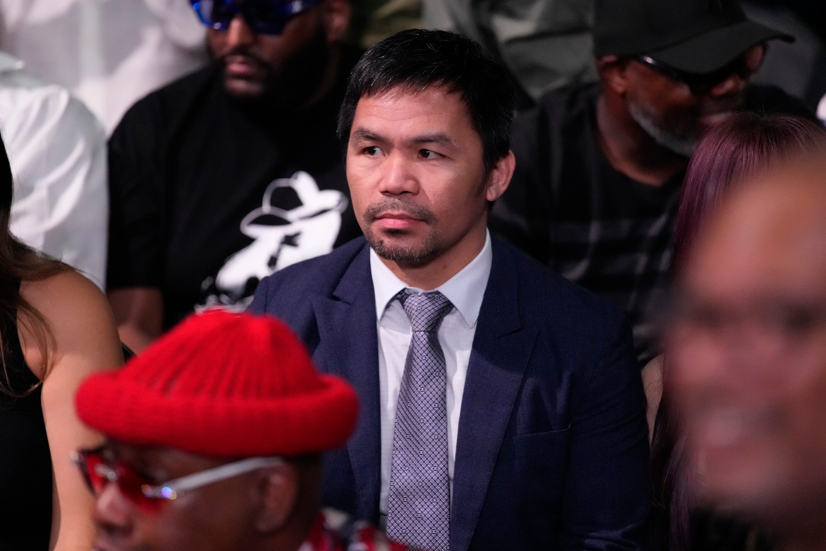 Former boxer Manny Pacquiao watches Errol Spence Jr. and Terence Crawford prior to their...