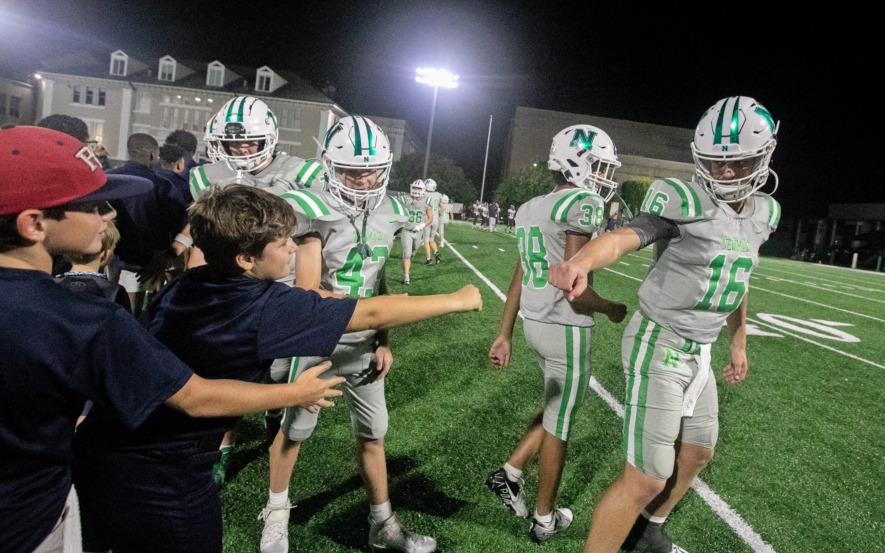 As Arch Manning shakes hands with referees, coaches and opponents, one young voice at the...