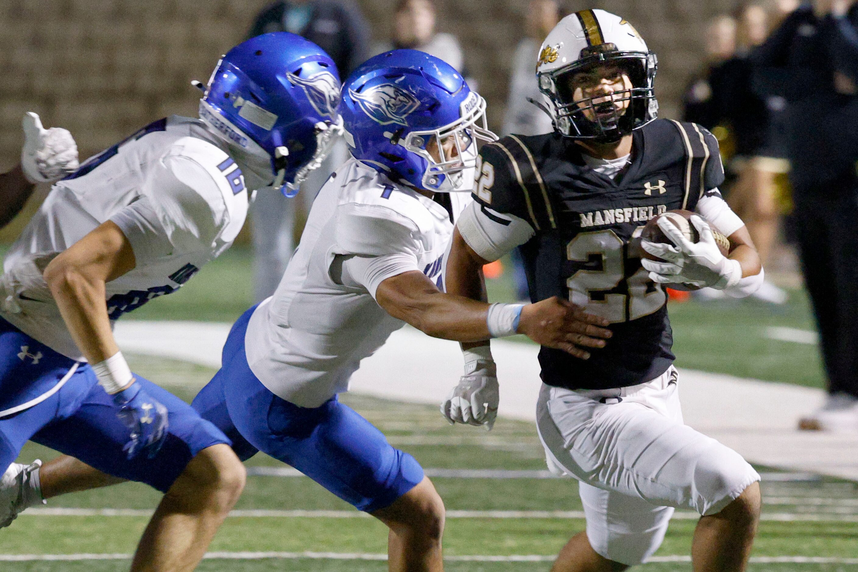 Mansfield's Jayden Vasquez (22) keeps the ball away from Weatherford's Sebastian Chazzareta...