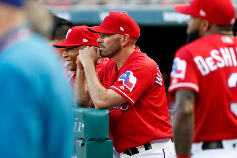 Texas Rangers Manager Chris Woodward looks on during a ceremony where former player Adrian...