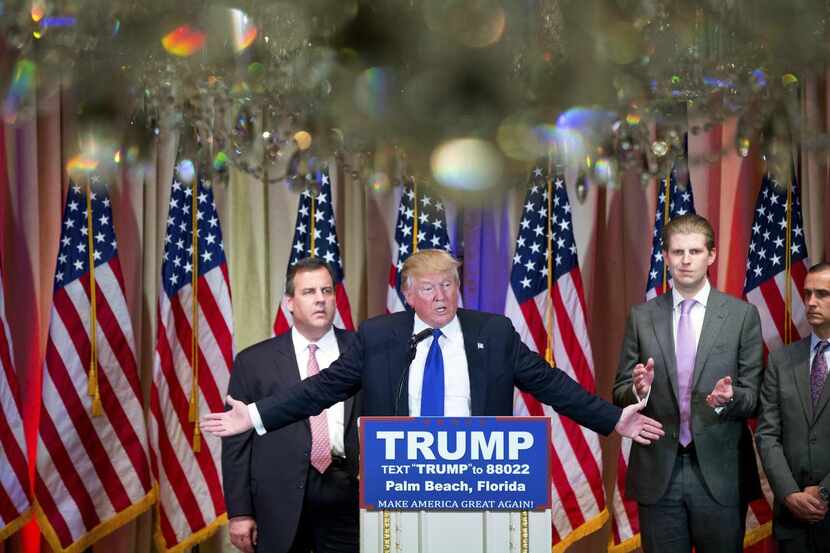 
Donald Trump, accompanied by New Jersey Gov. Chris Christie (left) and son Eric Trump...