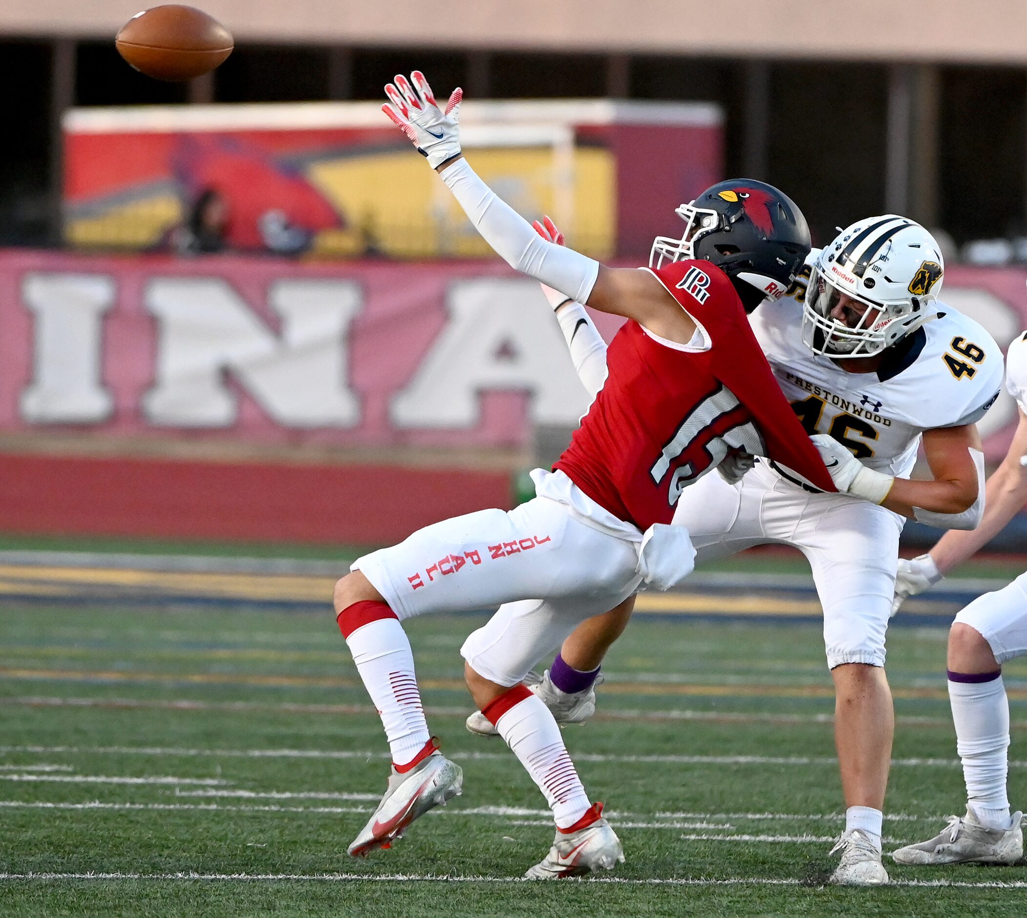 Prestonwood's Hudson Lunsford (46) breaks up a pass intended for John Paul II's Jude...