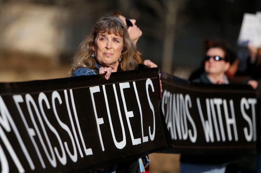 Linda Powers-Forsythe protests the pipeline with others across from the Earle Cabell Federal...