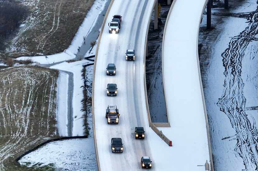 An icy mix covers Highway 114 on Monday, Jan. 30, 2023, in Roanoke.  Dallas and other parts...