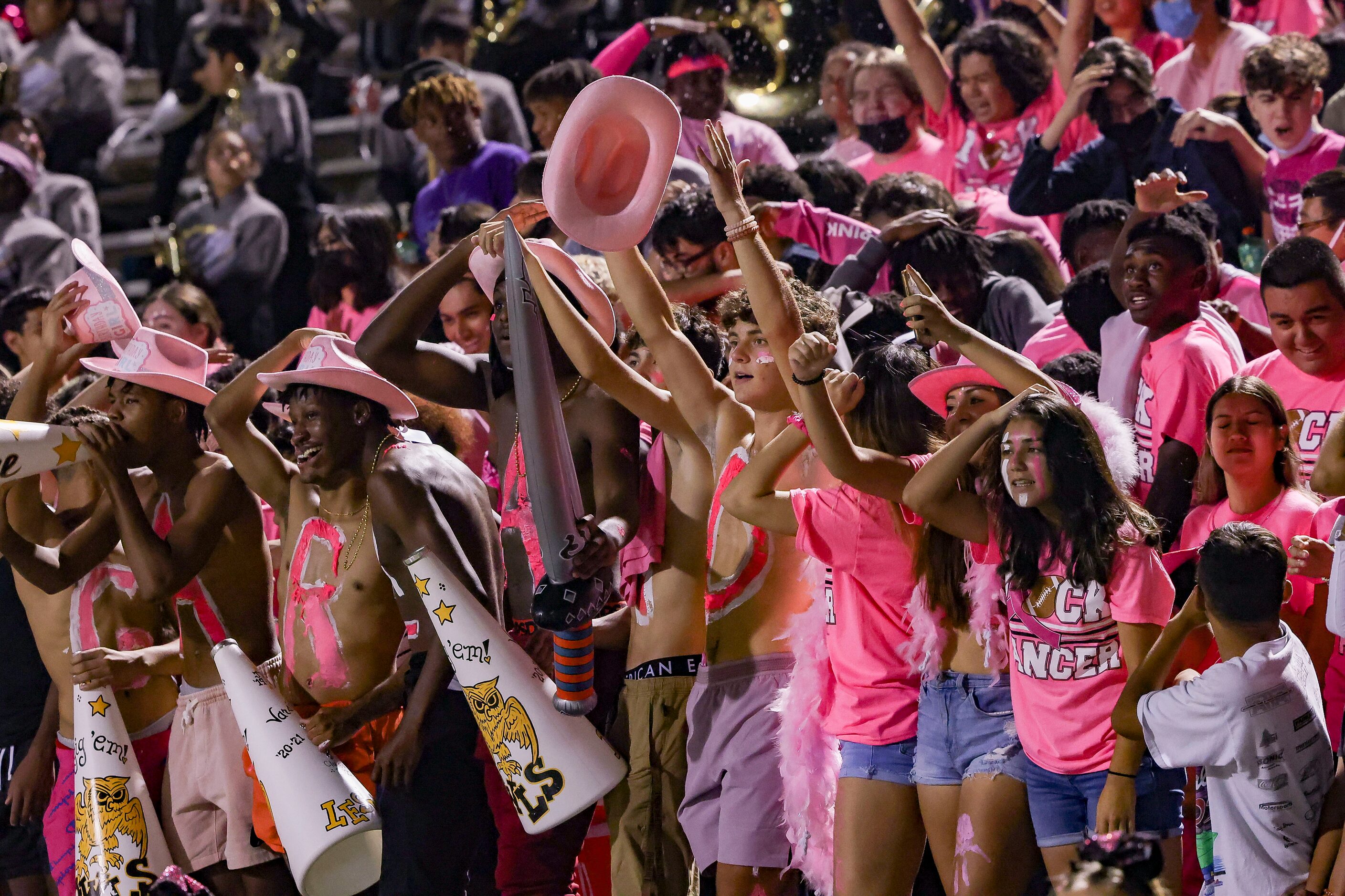 The Garland student section celebrates a touchdown during the second half of a District 9-6A...