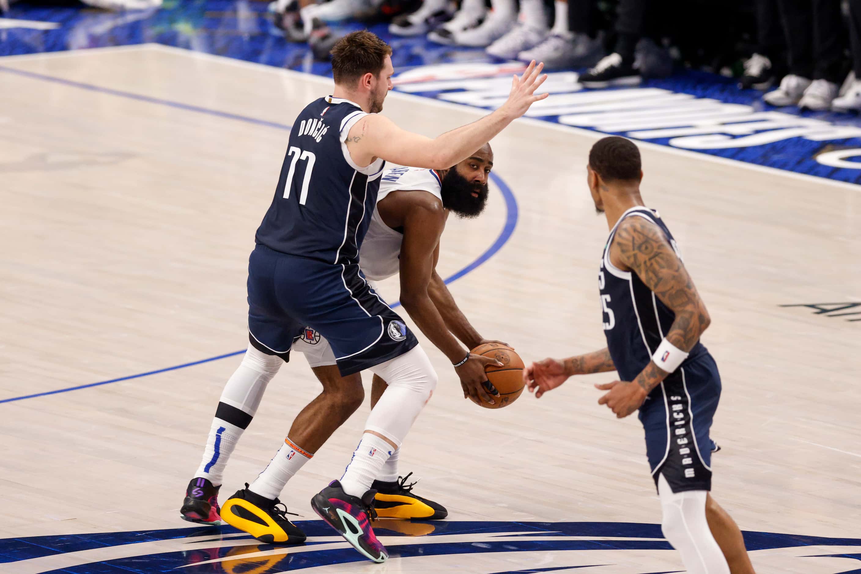Dallas Mavericks guard Luka Doncic (77) defends LA Clippers guard James Harden (1) during...