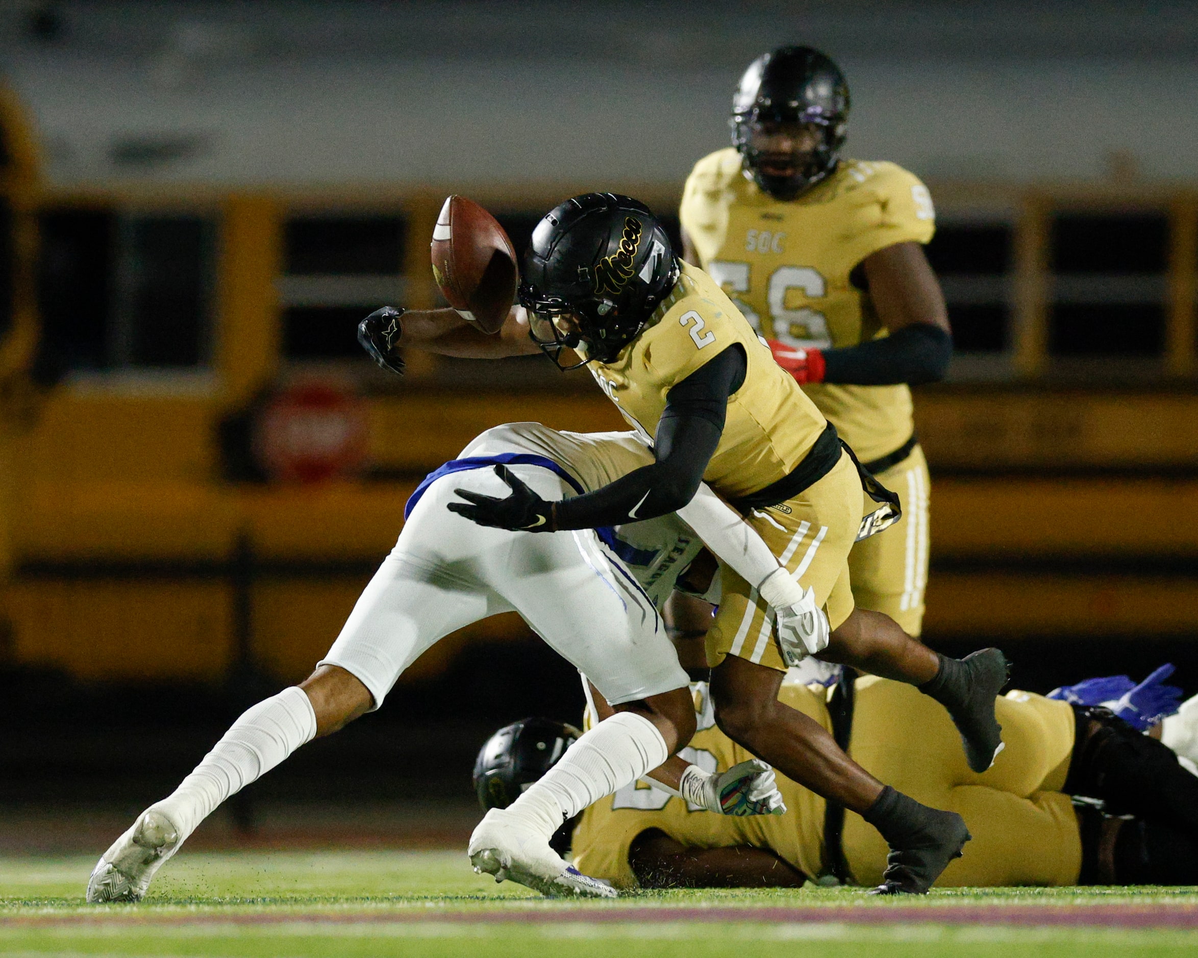 South Oak Cliff running back Tedrick Williams (2) fumbles the ball as Seagoville defensive...