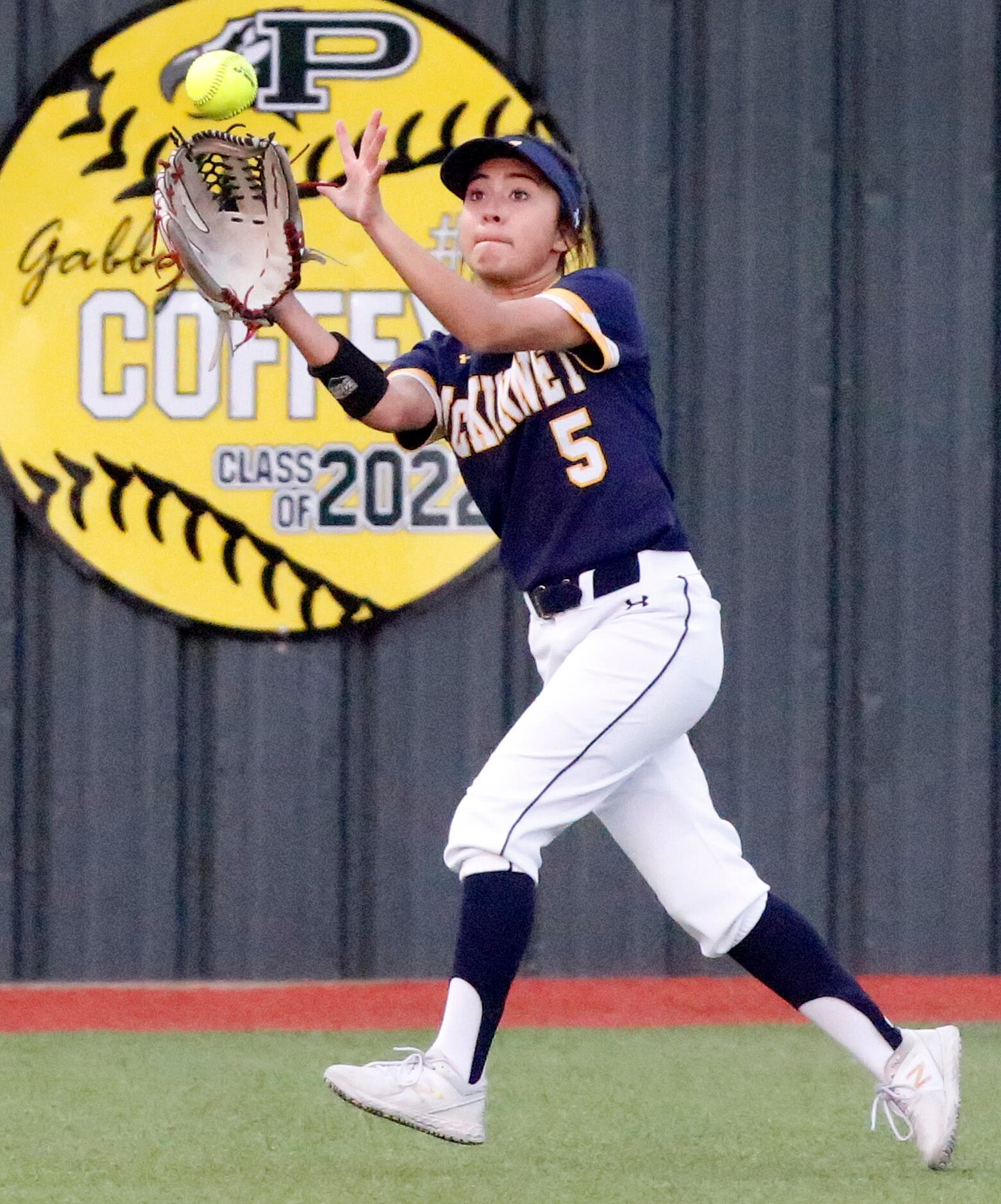 McKinney High School center fielder Mariah Trevino (5) makes a running catch in the first...