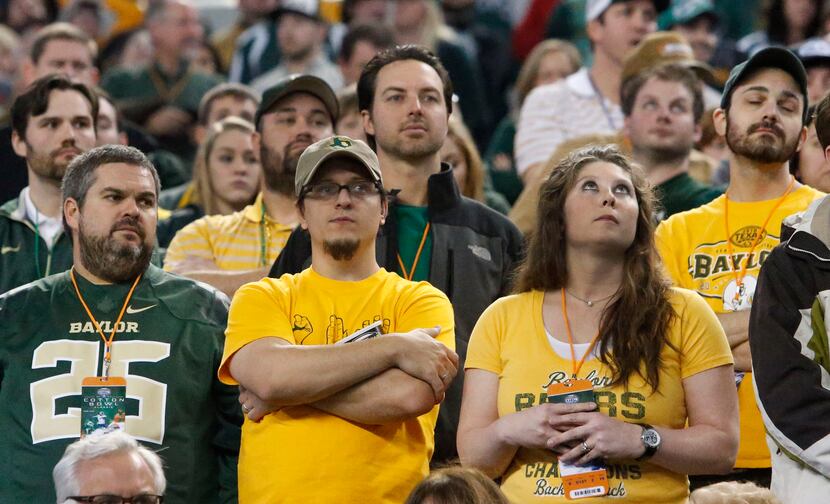 Baylor fans watch with dismay as the final seconds tick off the clock in the Bears' 42-41...