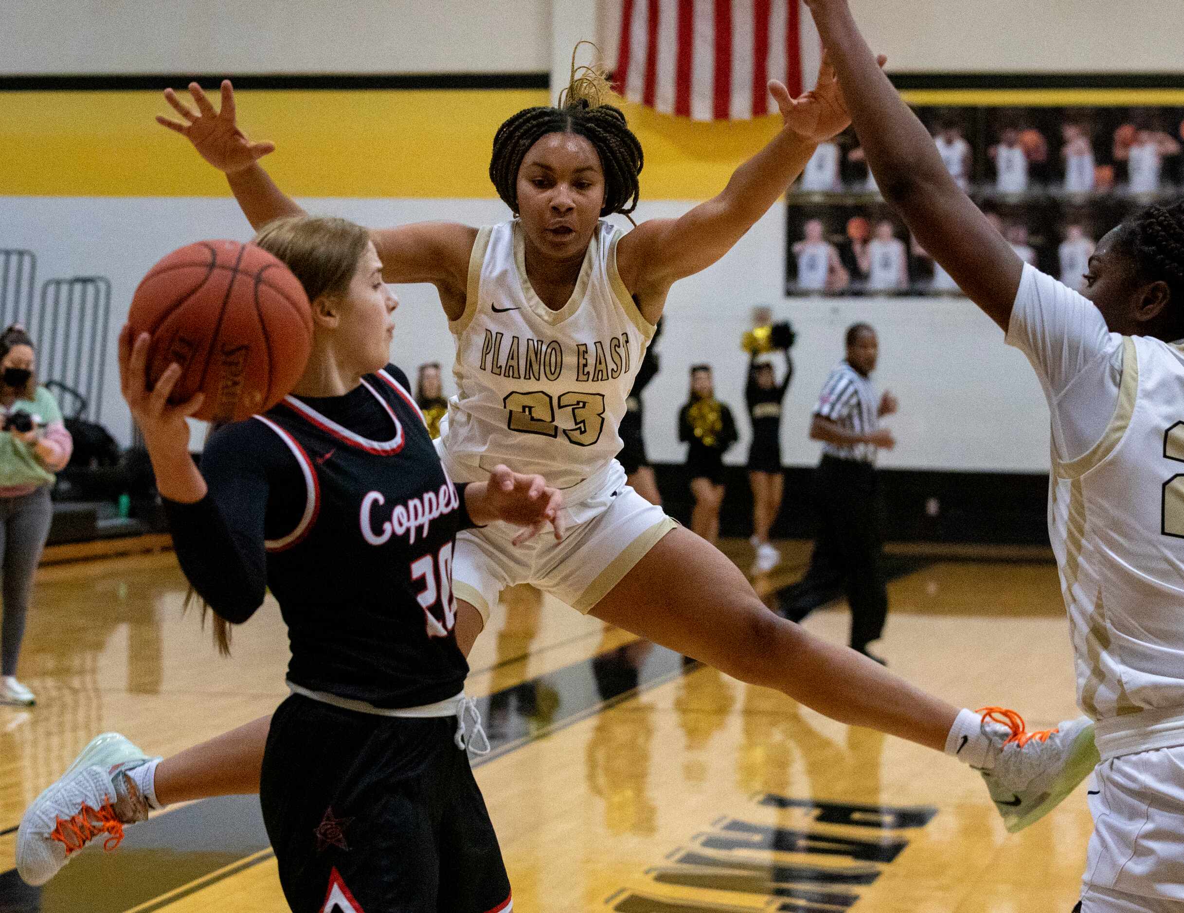 Plano East High School Donavia Hall (23) jumps to block a pass from Coppell High School...