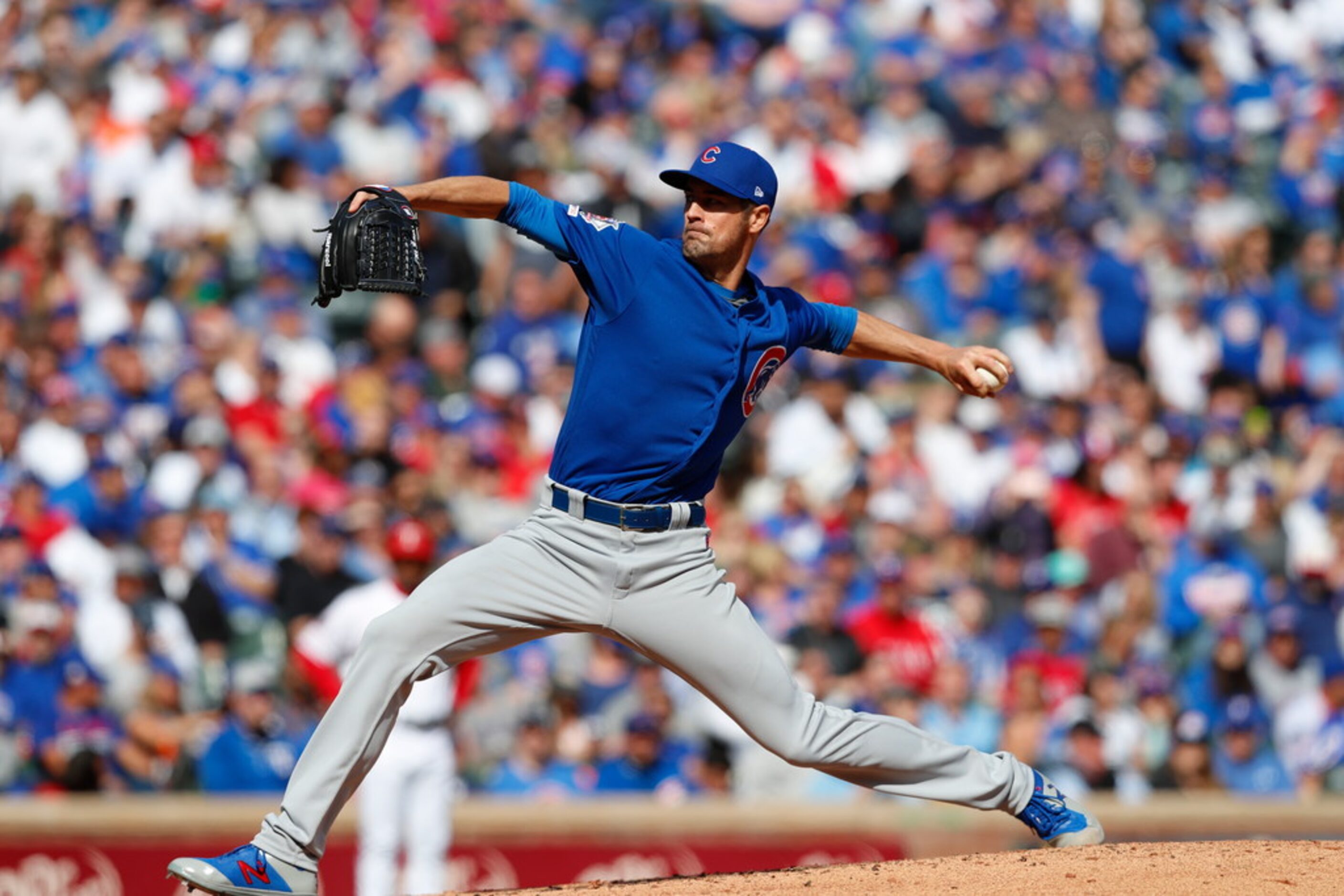 Chicago Cubs starting pitcher Cole Hamels throws during a baseball game against the Texas...