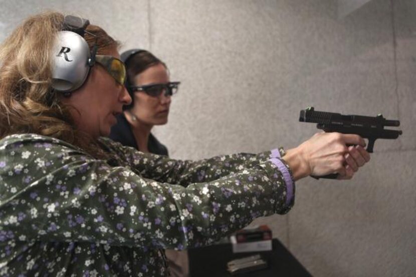 
Janie Brewer, left, shows her daughter Sarah Delapaz technique during Ladies Night at the...